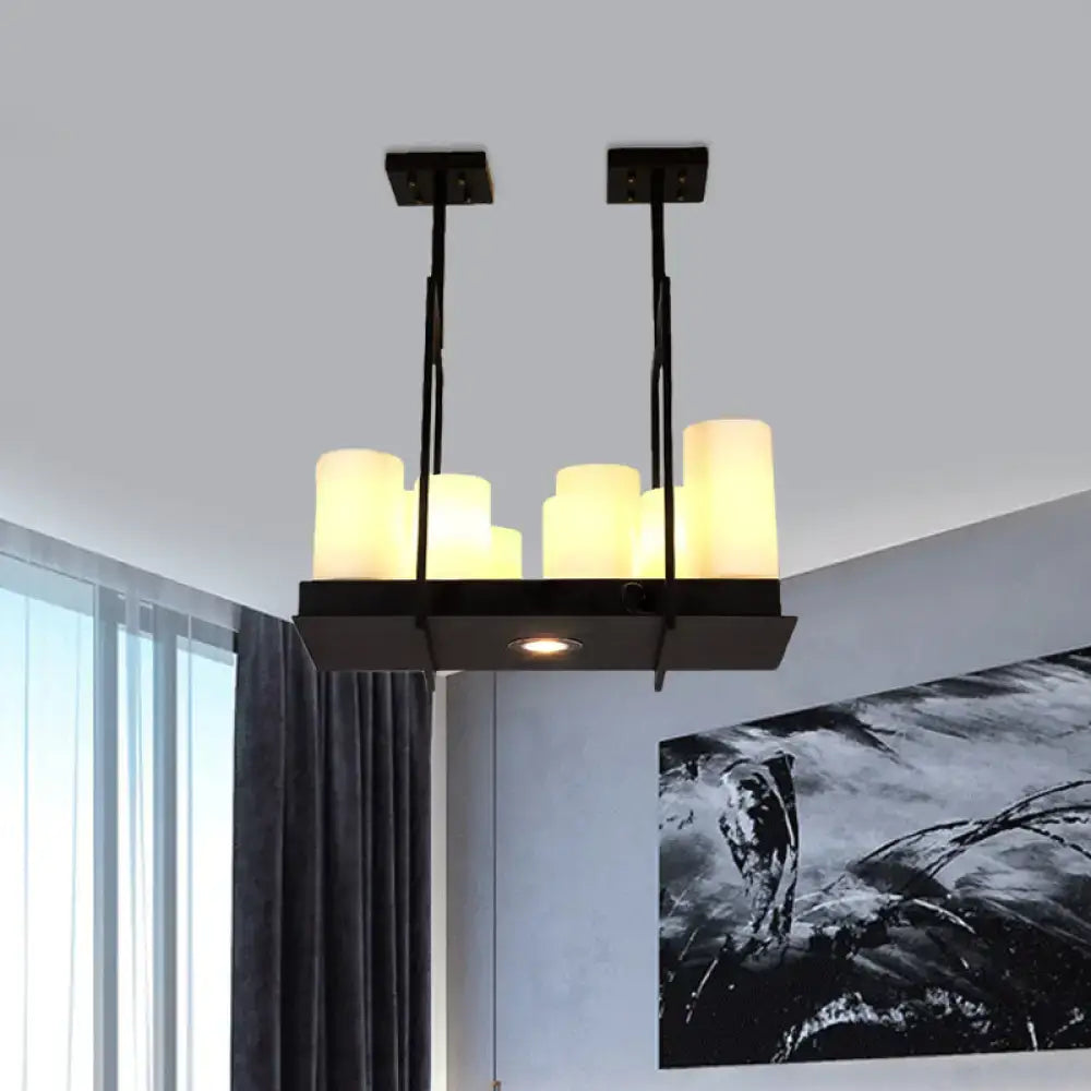 Black metal island pendant light with six warm-toned traditional barrel frosted glass shades for dining room use