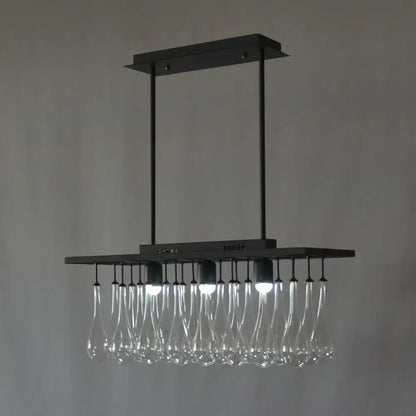 DecorBites traditional black island pendant light with clear glass pendant droplets and warm white illumination