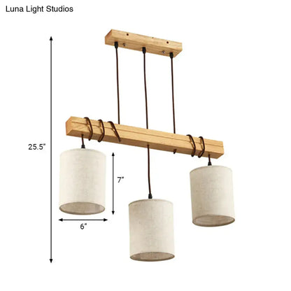 A minimalist wooden chandelier with three off-white fabric shades and black cords ideal for dining room fixture width e26 e27