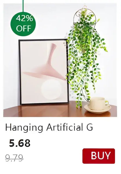 Hanging artificial green ivy plant with cascading leaves displayed in a decorbites™ transparent nordic vase with circular frame
