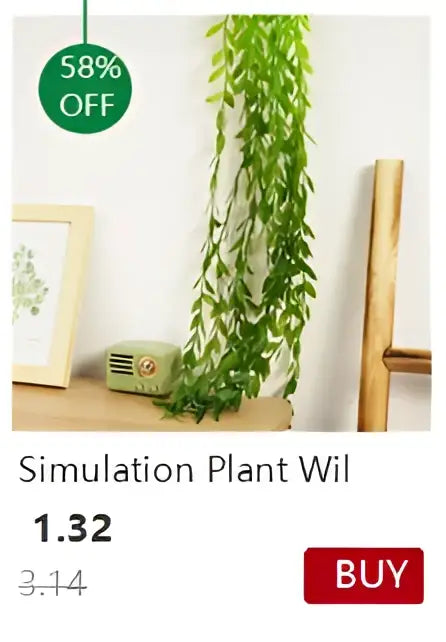 Green artificial hanging plant with long slender leaves in a transparent nordic vase by DecorBites for decoration