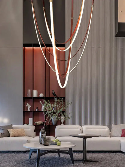 Modern sculptural decorbites™ led chandelier with intertwined copper and white flexible leather belt light strips
