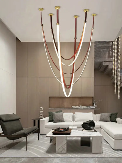 A modern DecorBites™ trendy diy flexible led chandelier light with white and brown leather belt and gold fixtures for living room