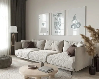 Beige upholstered sectional sofa with soft rounded armrests alongside decorbites™ trendy retro wall art posters set queen of hearts
