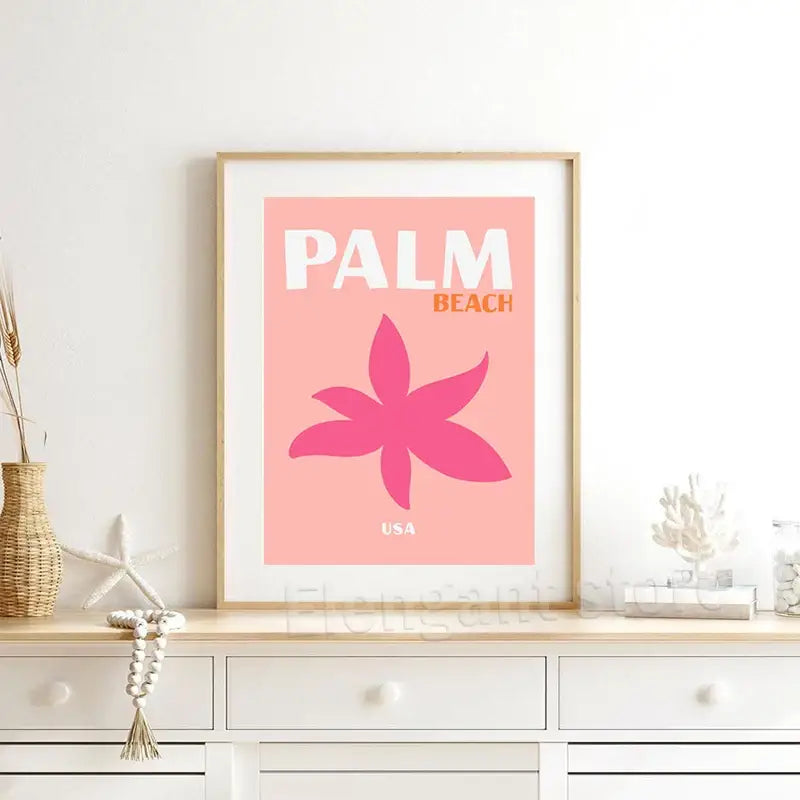 A framed DecorBites™ travel posters art print with pink background and stylized magenta flower for home decor