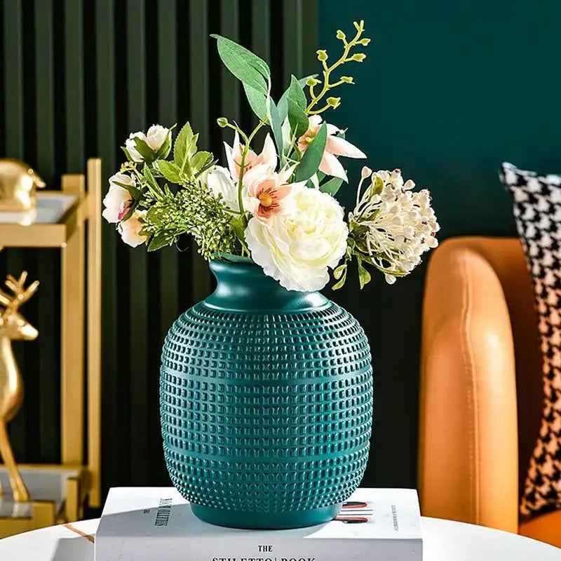 Teal ceramic DecorBites unbreakable modern floral vase with textured surface holding white and pink flowers for home decor