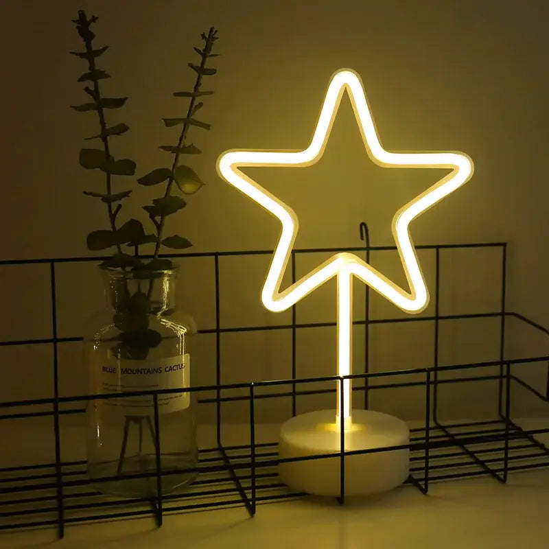 A glowing yellow led neon star-shaped lamp with a modern design and white base for DecorBites™ usb led neon sign use