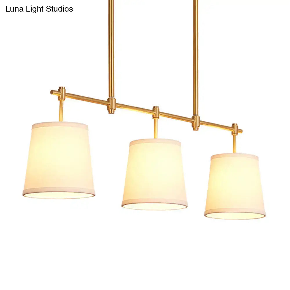 DecorBites vintage 3-head brass pendant light with three off-white fabric shades in retro style bucket island design