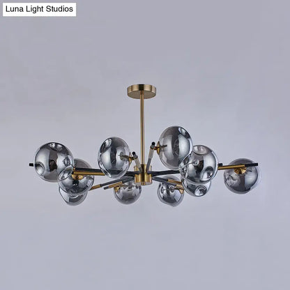 Modern brass flush mount chandelier with multiple reflective silver glass spheres for elegant living room lighting