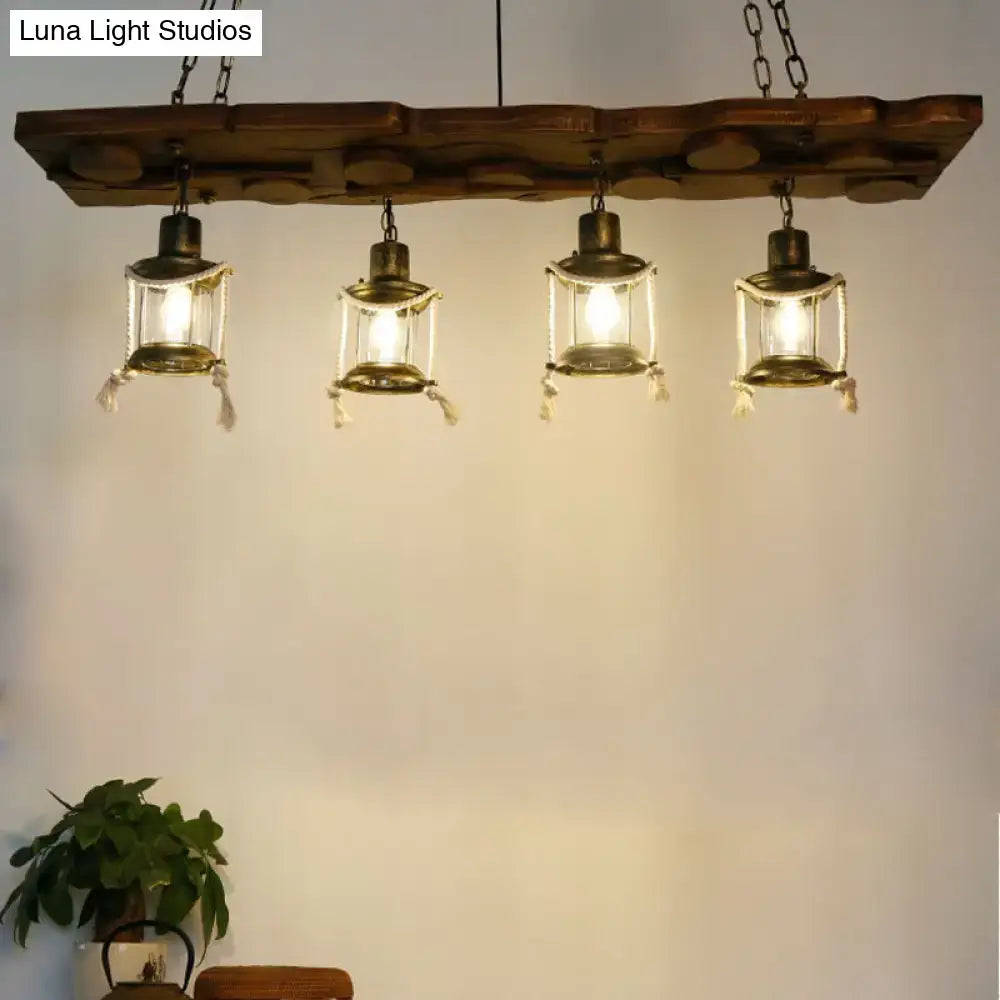 Rustic dark wood island lamp with four brass lantern lights hanging from chains for vintage decor