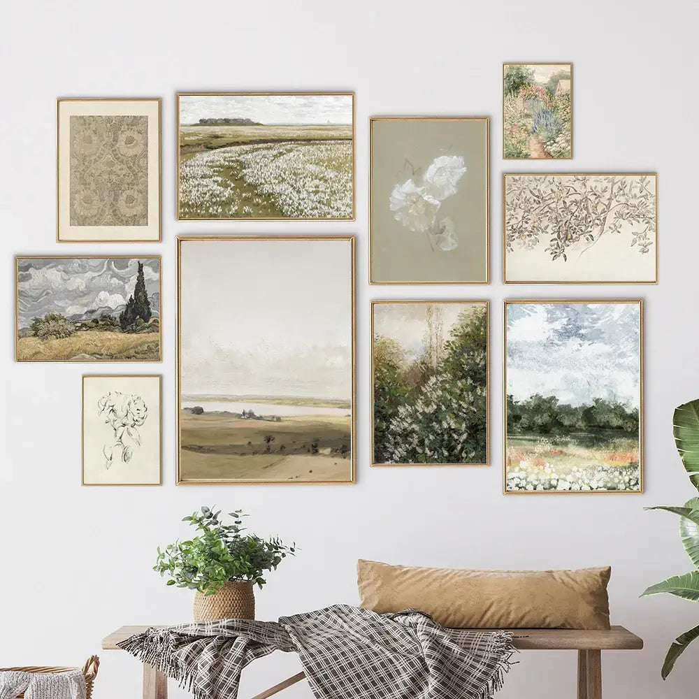 A set of nine vintage farmhouse landscape wall art prints in muted earth tones with slender gold-toned frames