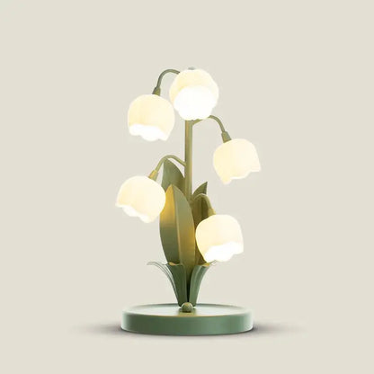 DecorBites vintage floral table lamp with translucent white petals and sage green stems as a softly glowing table lamp