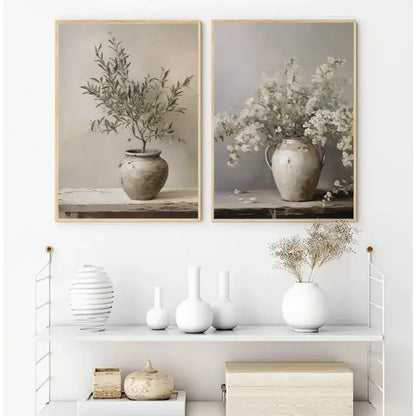 Two framed DecorBites vintage floral vase canvas wall art featuring rustic ceramic vases with olive branches and white flowers
