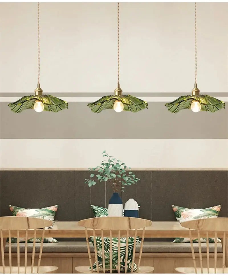 Three decorbites vintage flower glass pendant lights with brass fixtures and green leaf-shaped shades for home decor