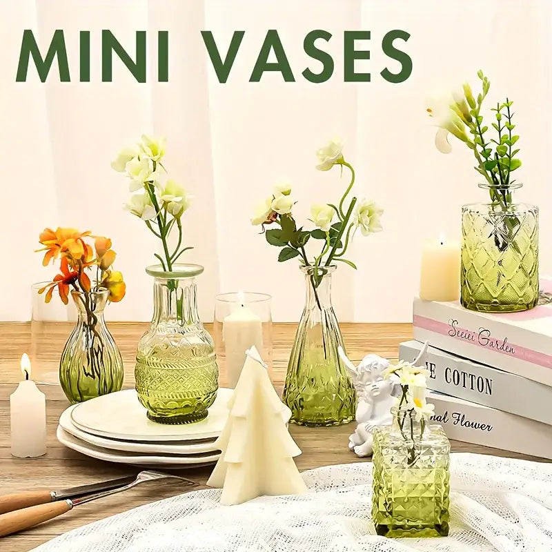 Set of five green patterned glass bud vases holding delicate white and orange flowers from decorbites vintage glass bud vases set