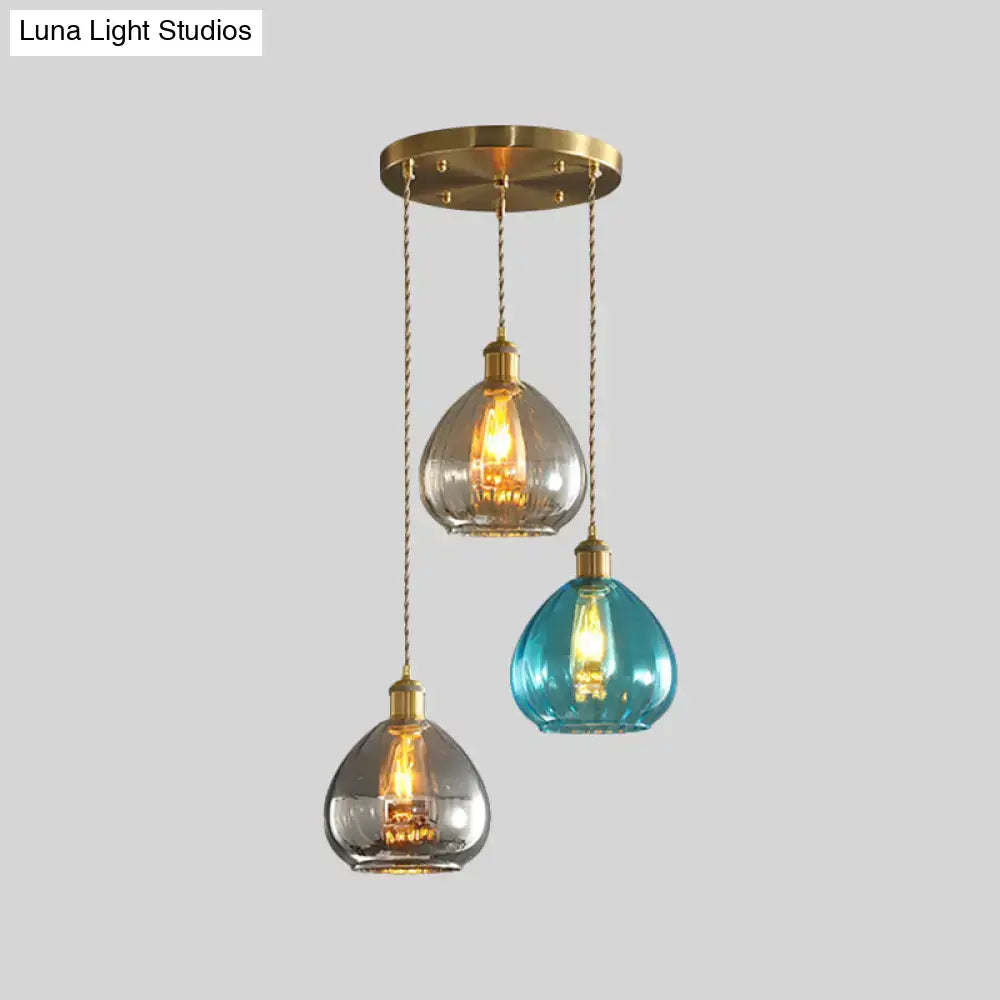 DecorBites™ vintage glass onion multi ceiling light pendant with three teal and clear glass shades and brass chains