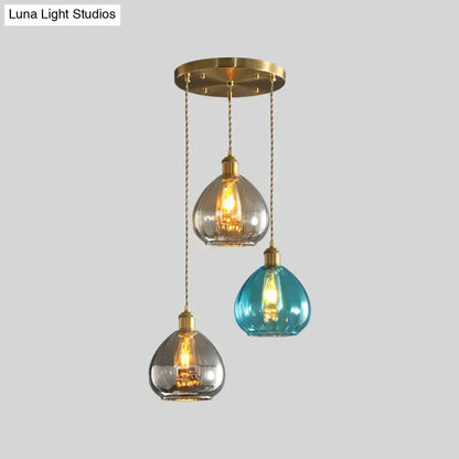 DecorBites™ vintage glass onion multi ceiling light pendant with three teal and clear glass shades and brass chains