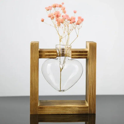 Decorbites vintage heart-shaped glass vase with delicate pink babys breath in a rustic wooden frame glass display