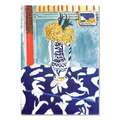 A white ceramic vase with blue patterns holding yellow flowers beside decorbites™ vintage matisse abstract landscape wall art
