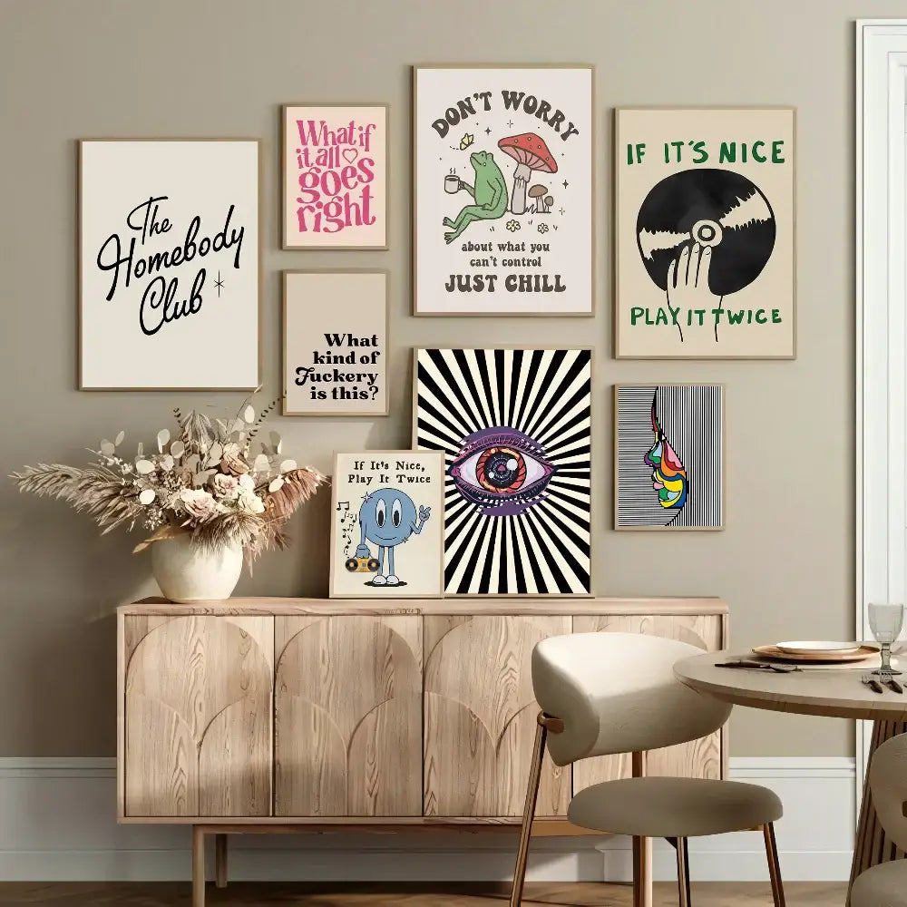 A collection of decorbites™ vintage pink cartoon canvas posters with colorful typography displayed above a wooden console table