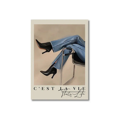 Black leather high-heeled ankle boots paired with light blue denim jeans complement vintage pink cartoon canvas posters