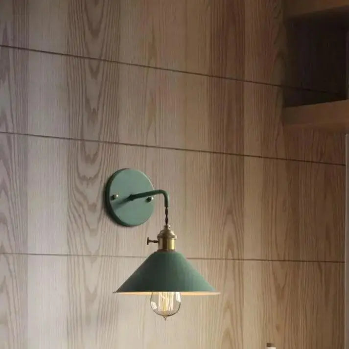 Teal colored industrial style decorbites vintage plated wall lamp with brass finished arm and exposed filament bulb