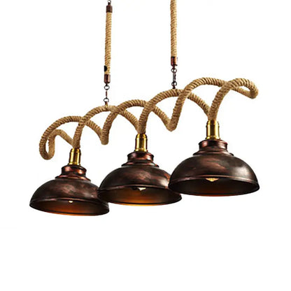 DecorBites vintage rust finish three-light pendant with copper dome shades and natural rope cord suspension
