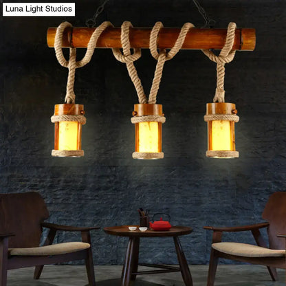 Rustic wooden beam chandelier with three amber glass lanterns wrapped in beige rope cord for 110v-120v use