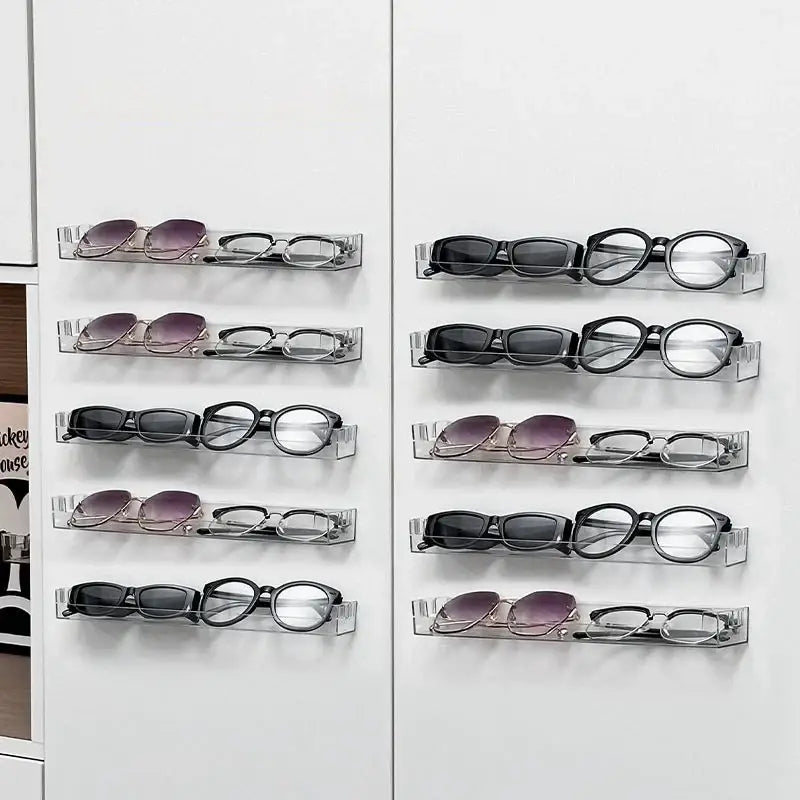 DecorBites™ wall mounted transparent clear acrylic storage rack holding multiple pairs of eyeglasses and sunglasses