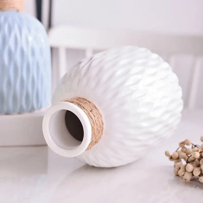 White ceramic decorbites™ ripple plastic vase with textured diamond pattern and natural twine wrap in modern nordic style