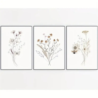 Set of three minimalist watercolor flower posters with delicate flowers butterflies and bees in slim black frames