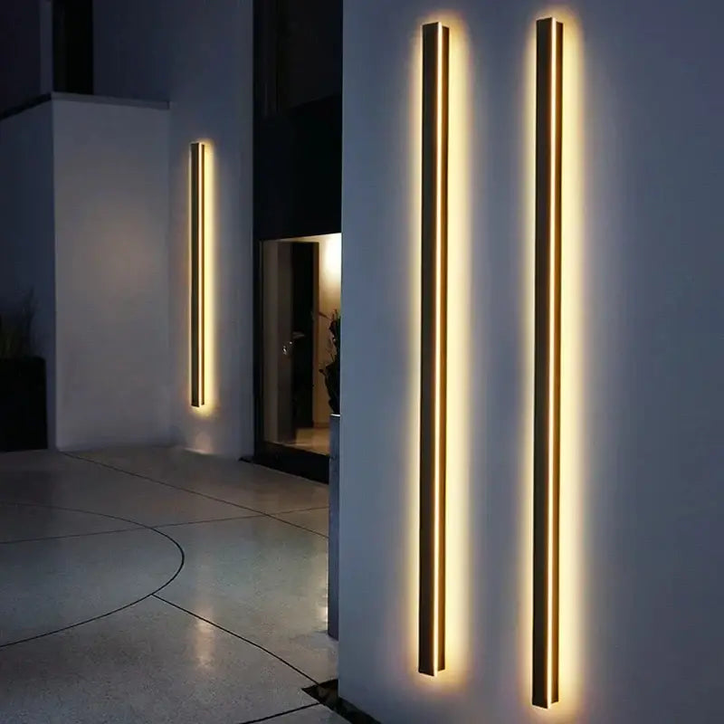 Modern gold-accented DecorBites™ waterproof led outdoor wall light with warm glowing illumination and sleek linear design