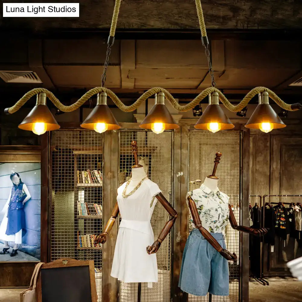 Industrial pendant lights with warm black metal shade and wavy hemp rope suspension for rustic hemp rope island use