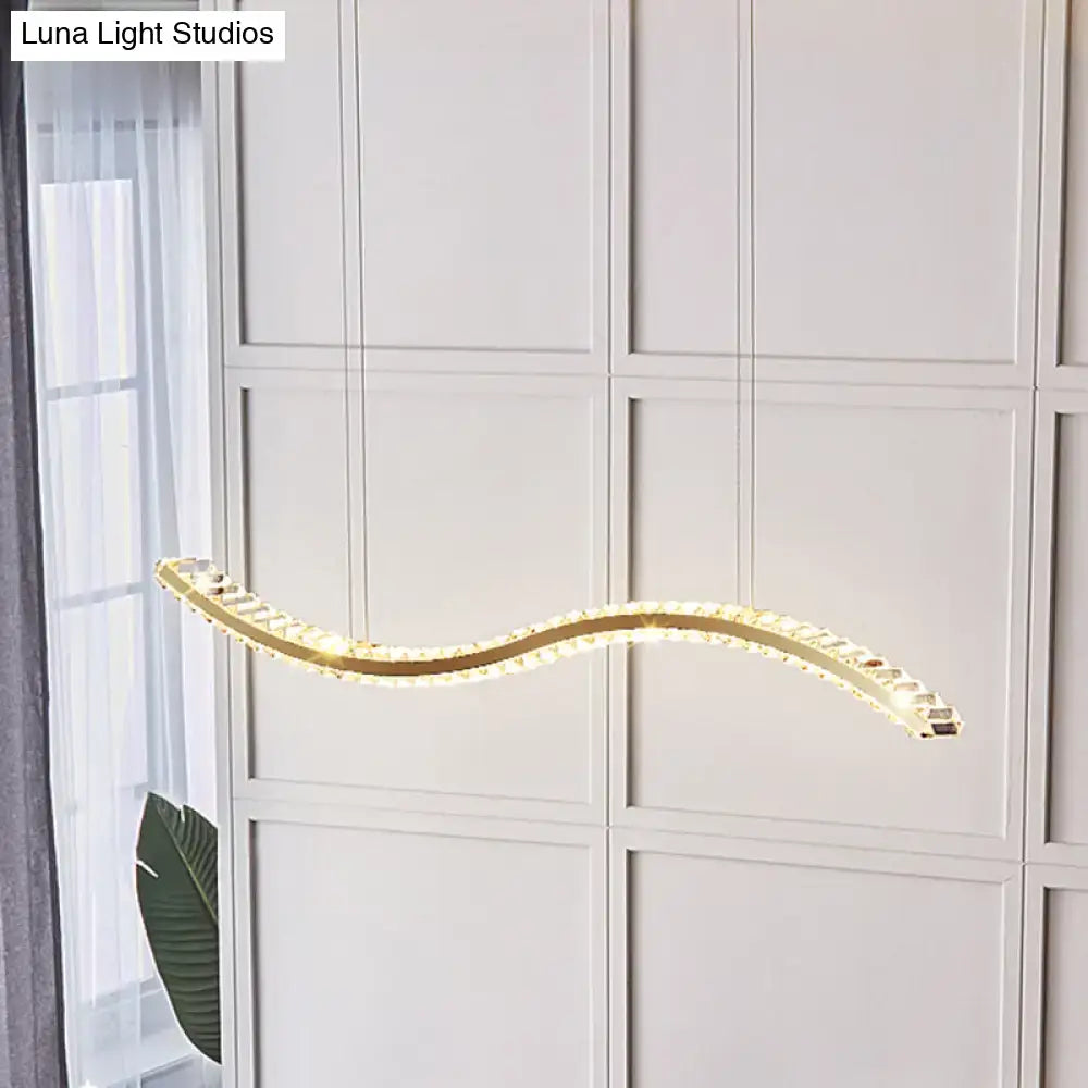 Gold-toned wavy k9 crystal LED pendant lighting with warm glow for dining room featuring remote control option