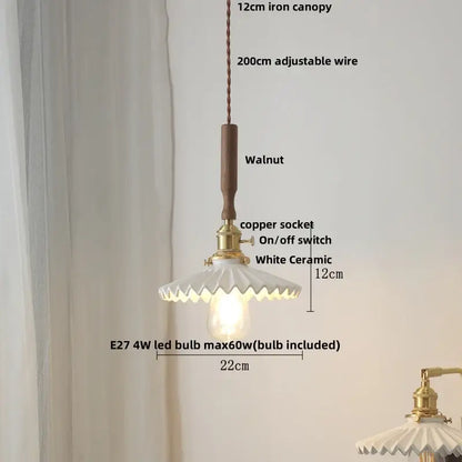 Rustic pendant light with walnut wood handle, brass socket, and scalloped white ceramic led shade, adjustable wire