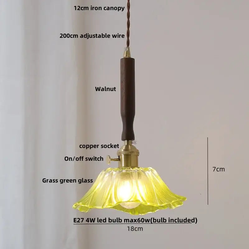 A delicate grass green glass pendant light with dark walnut iron canopy paired with vintage cream white ceramic led pendant light