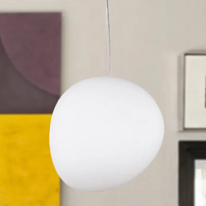 DecorBites™ white glass oval pendant light with matte finish and minimalist design hangs from thin metallic cord