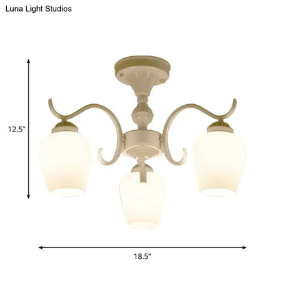 Cream-colored DecorBites™ chandelier with three curved arms and frosted opaline glass cone shades