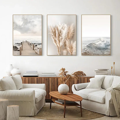 Set of three framed decorbites™ white seascape canvas prints featuring coastal and pampas grass in muted earthy tones