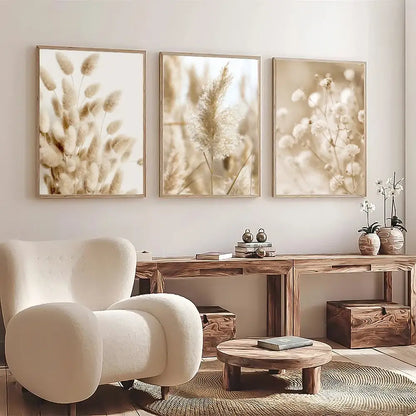 Beige plush armchair with rounded contours and wooden legs next to decorbites™ white seascape canvas set wall art