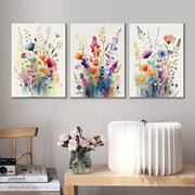 Set of three vibrant wildflowers watercolour posters with colorful blossoms on canvas wall art by DecorBites™