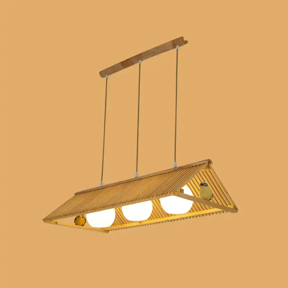 DecorBites wooden asian triangle island pendant light in natural wood finish with three glowing bulbs and decorative birds