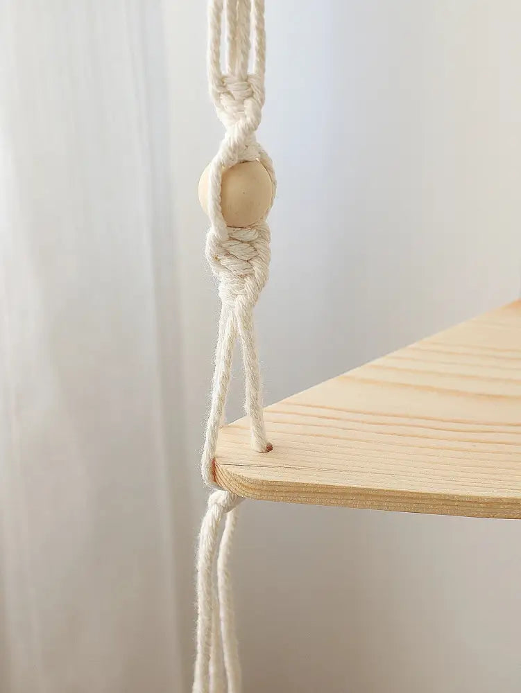 Decorbites™ wooden corner shelf with macrame features a minimalist natural wood finish and cream cotton rope with wooden bead