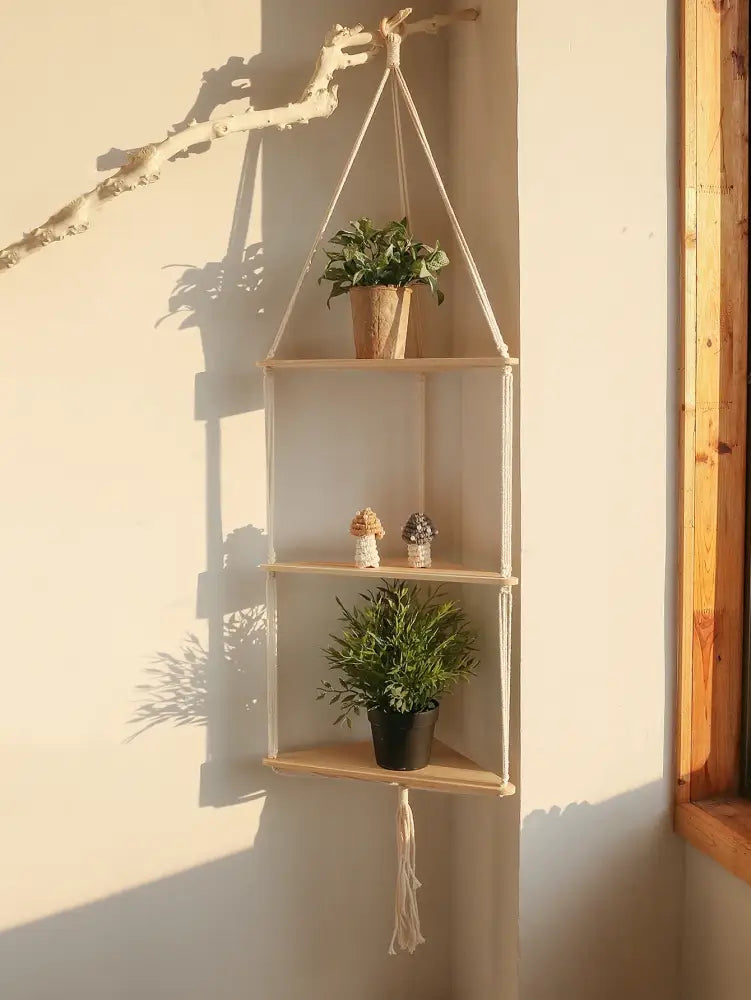 Beige DecorBites™ wooden corner shelf with three-tier macrame hanging design for boho wall decor