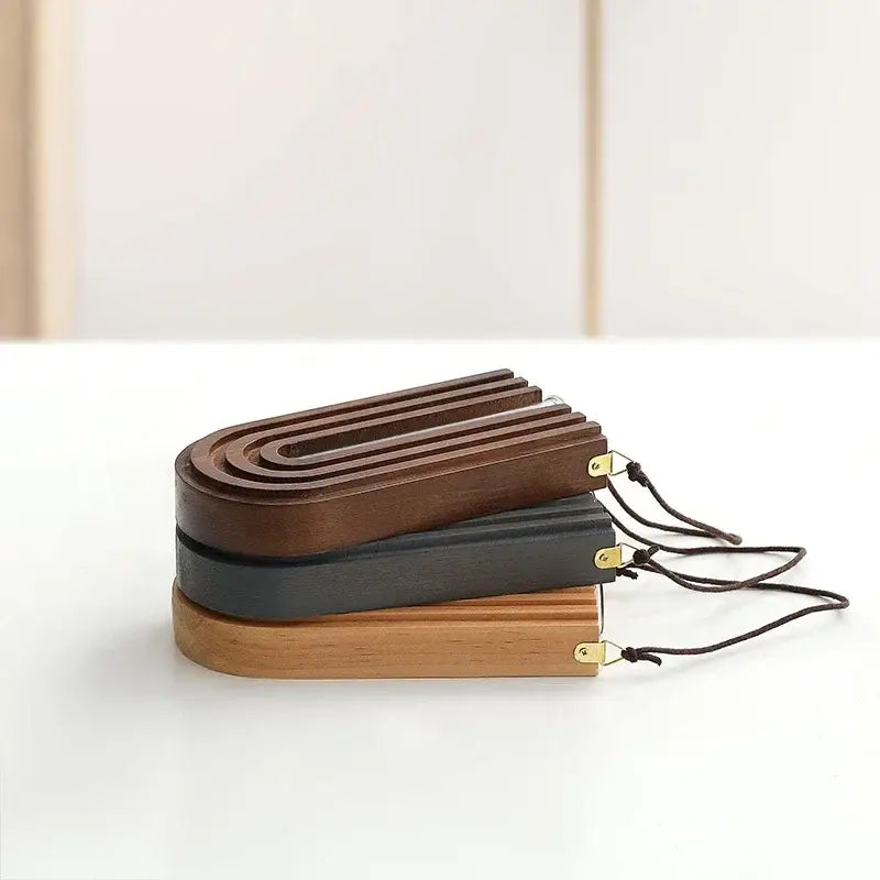 Stacked wooden flower vase wall mount holders in rich brown, charcoal gray, and natural tones with brass accents and black cords
