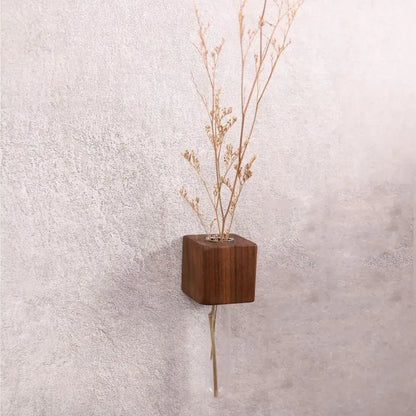 A sleek dark brown wooden cube magnetic test tube vase with a clear glass stem for diy flower arrangement