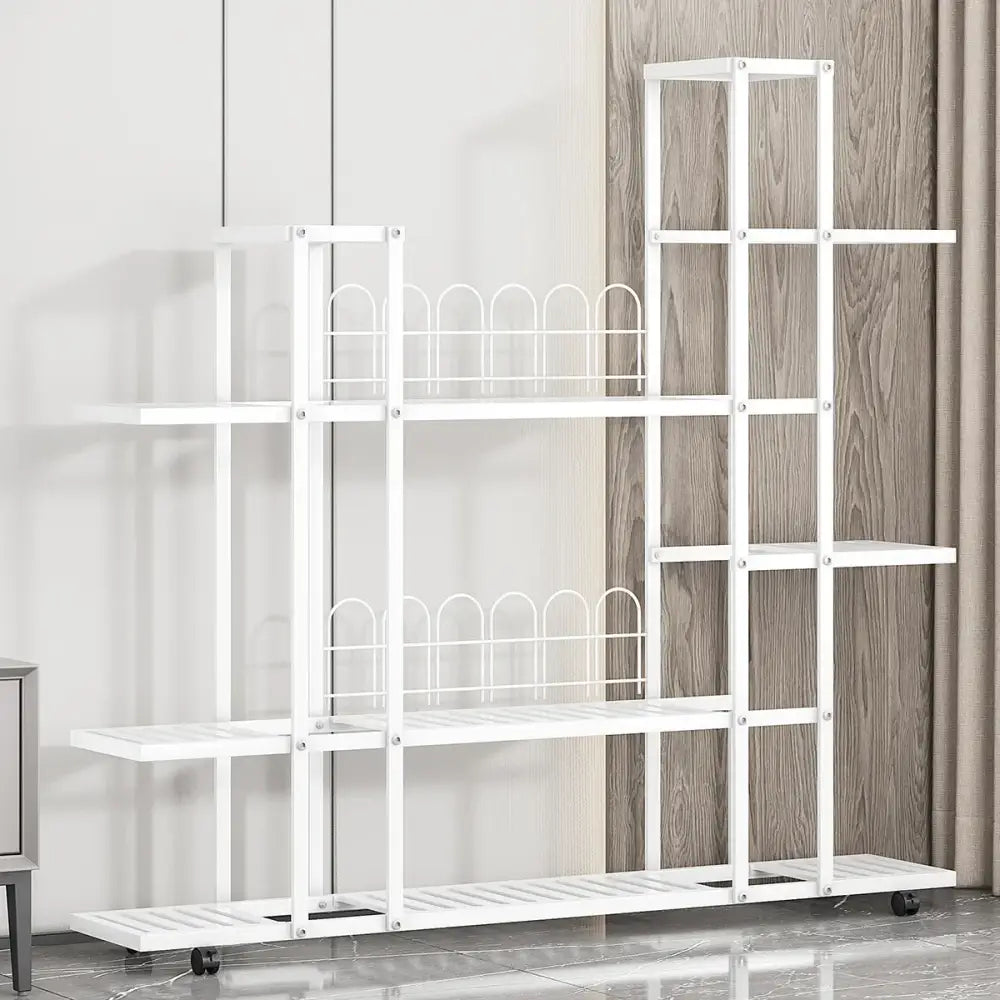White wrought iron plant stand with multiple shelves and decorative arched wire dividers on wheels by decorbites