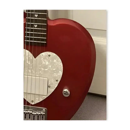 A glossy red electric guitar with a heart-shaped white pearl pickguard and silver hardware in y2k rock style decorbites canvas poster