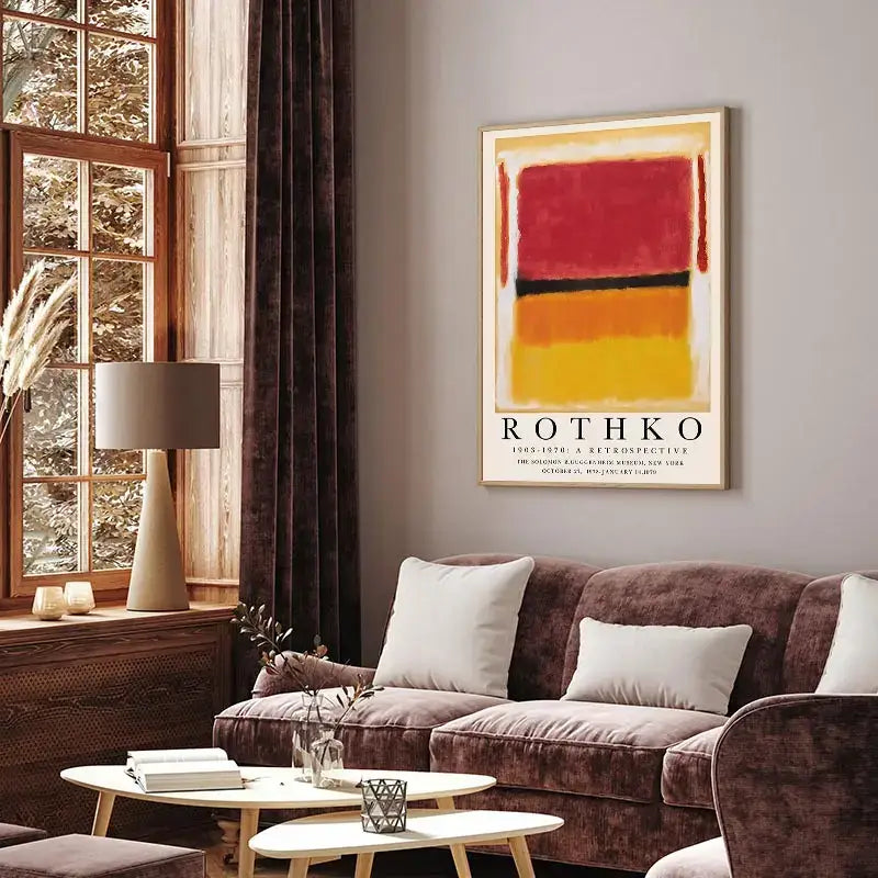 A framed yayoi kusama inspired floral canvas art featuring bold red orange and yellow bands with black text below