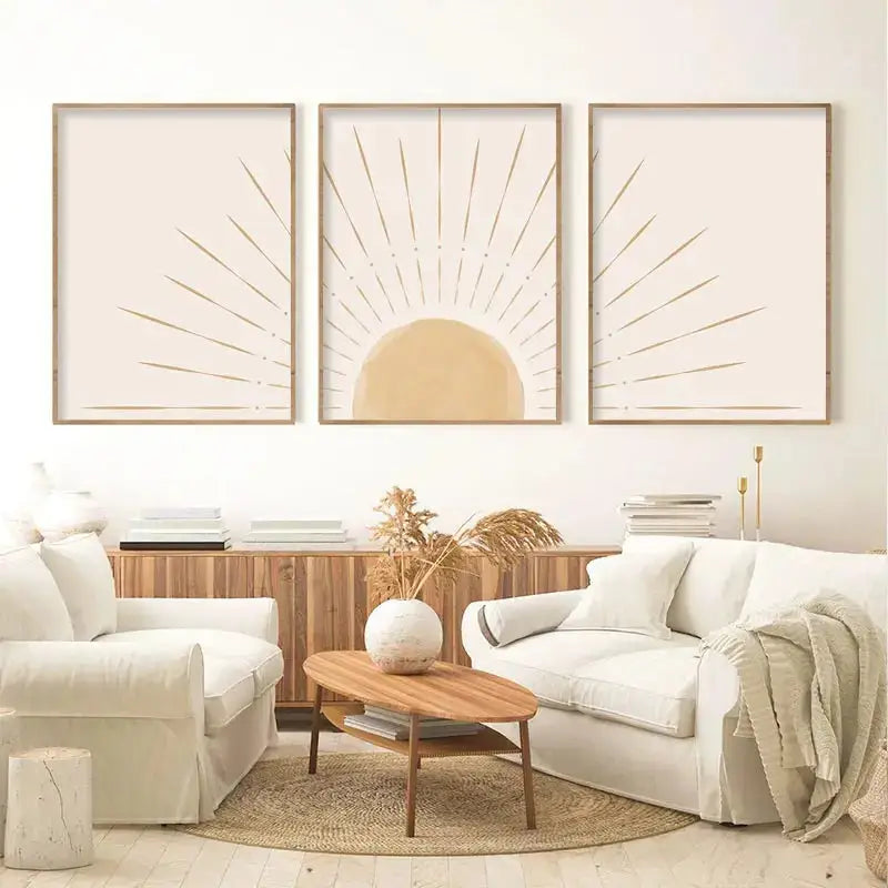 Set of three DecorBites™ yellow sun rising horizon wall art prints with beige and gold rays in light wood frames